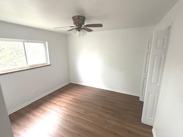 2209 171st St, Hazel Crest, IL 60429 - spare room with a ceiling fan, wood finished floors, and baseboards
