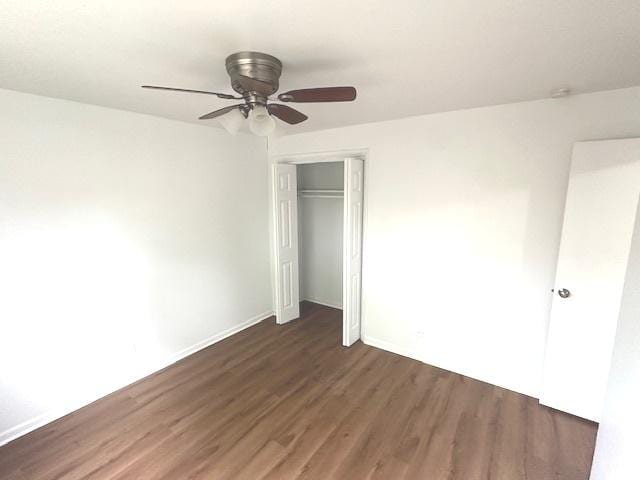 2209 171st St, Hazel Crest, IL 60429 - unfurnished bedroom featuring wood finished floors, a closet, baseboards, and a ceiling fan
