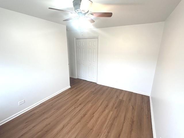 2209 171st St, Hazel Crest, IL 60429 - unfurnished room with wood finished floors, baseboards, and ceiling fan