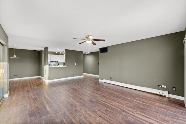1926 Prairie Sq Unit 234, Schaumburg, IL 60173 - unfurnished living room featuring a baseboard radiator, a ceiling fan, dark wood-type flooring, and baseboards