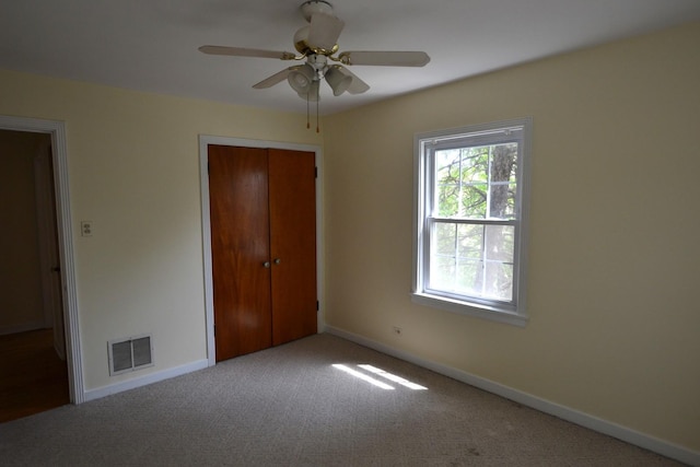 10514 S Artesian Ave Unit 2E, Chicago, IL 60655 - unfurnished bedroom with a closet, carpet, baseboards, and a ceiling fan