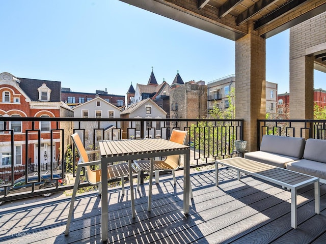 wooden deck featuring an outdoor living space and a residential view