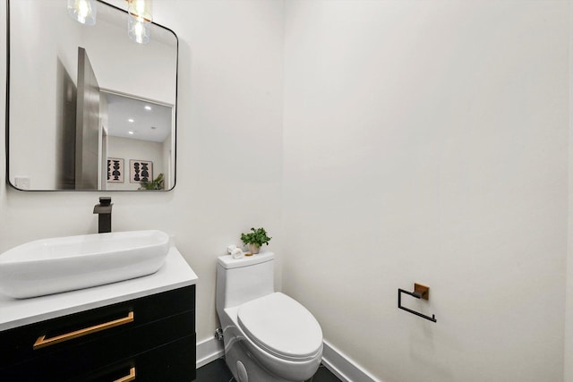 7453 Washington St, Forest Park, IL 60130 - bathroom with toilet, vanity, and baseboards