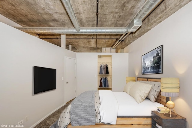 bedroom with baseboards and carpet flooring