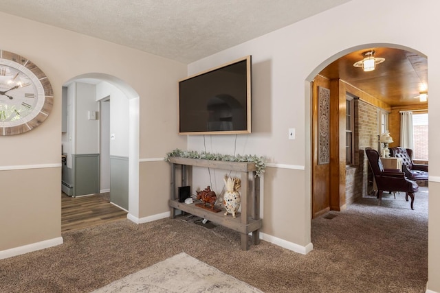 315 W Bennett St, Pontiac, IL 61764 - living area with carpet floors, baseboards, and arched walkways
