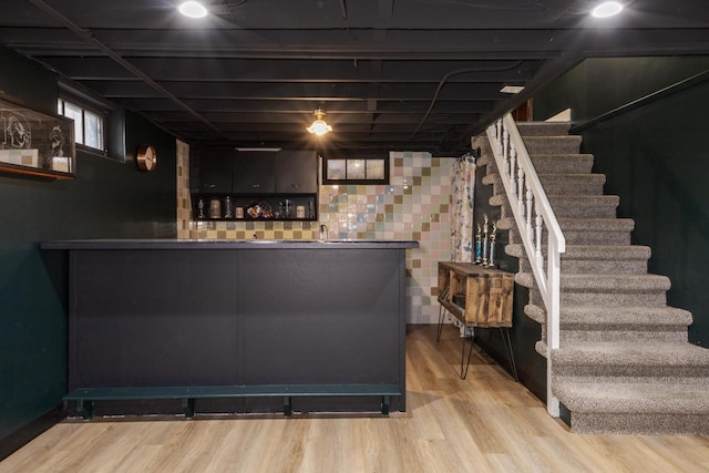 315 W Bennett St, Pontiac, IL 61764 - indoor wet bar featuring stairs and wood finished floors