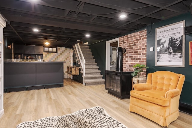 315 W Bennett St, Pontiac, IL 61764 - finished below grade area with wood finished floors, a wood stove, a dry bar, and stairway
