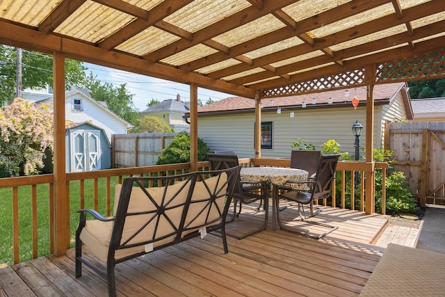 315 W Bennett St, Pontiac, IL 61764 - wooden deck with a shed, outdoor dining area, and an outdoor structure