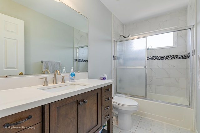 13 Caribou Ct, Bolingbrook, IL 60490 - full bath featuring toilet, tile patterned floors, vanity, and bath / shower combo with glass door