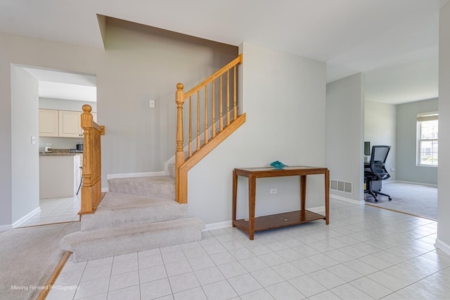 13 Caribou Ct, Bolingbrook, IL 60490 - stairway with carpet flooring, tile patterned floors, and baseboards