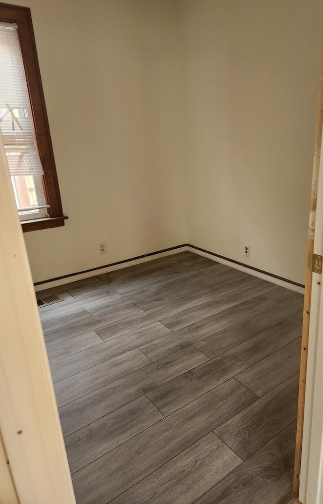 10435 S Calhoun Ave, Chicago, IL 60617 - empty room with dark wood-style flooring