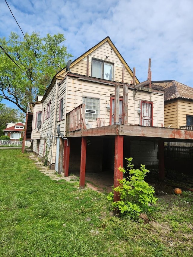 10435 S Calhoun Ave, Chicago, IL 60617 - back of house featuring a yard and a wooden deck