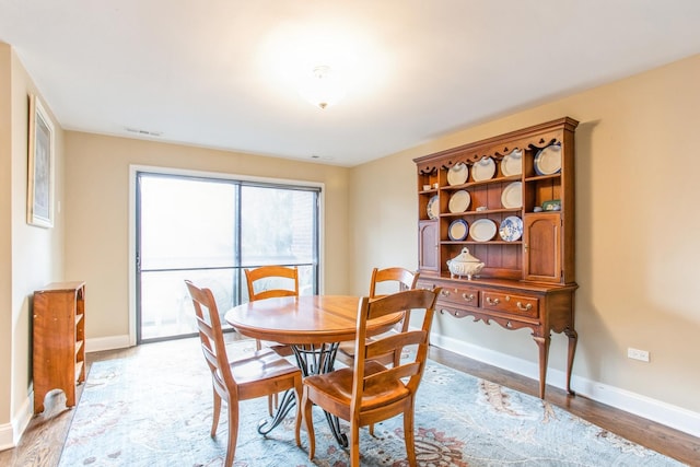 1401 Burr Oak Rd Unit 314B, Hinsdale, IL 60521 - dining room with baseboards and light wood-style floors