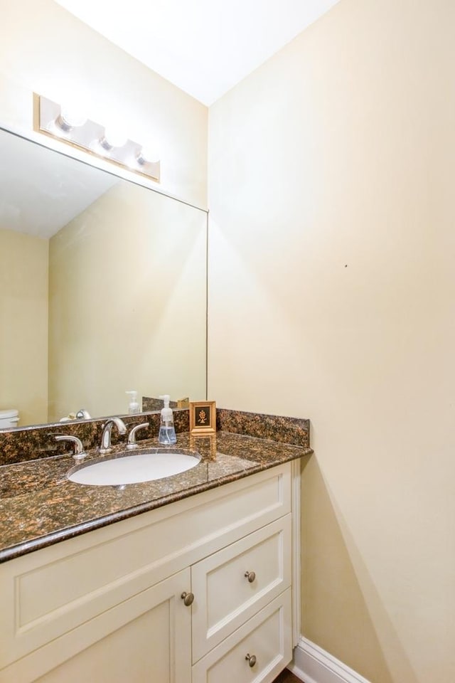 1401 Burr Oak Rd Unit 314B, Hinsdale, IL 60521 - half bathroom featuring vanity and toilet