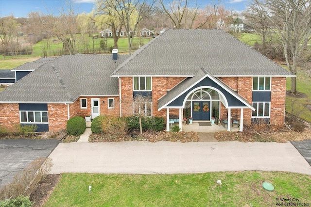 1375 Atkinson Rd, Green Oaks, IL 60048 - back of house with french doors, a shingled roof, and brick siding
