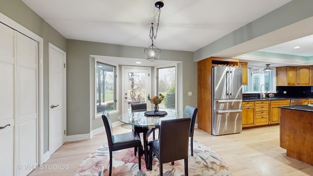 1375 Atkinson Rd, Green Oaks, IL 60048 - dining area with light wood-type flooring, healthy amount of natural light, and baseboards