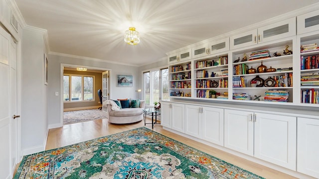 1375 Atkinson Rd, Green Oaks, IL 60048 - sitting room with light wood-style floors, ornamental molding, plenty of natural light, a chandelier, and baseboards