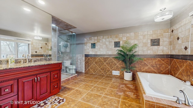 1375 Atkinson Rd, Green Oaks, IL 60048 - full bathroom featuring tile walls, a stall shower, tile patterned flooring, a garden tub, and vanity