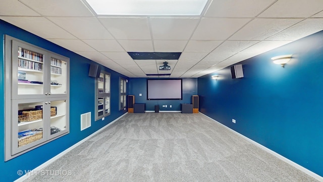 1375 Atkinson Rd, Green Oaks, IL 60048 - cinema featuring carpet, a drop ceiling, baseboards, and built in shelves