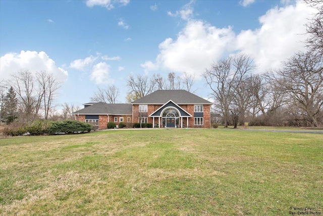 1375 Atkinson Rd, Green Oaks, IL 60048 - rear view of house with brick siding and a yard