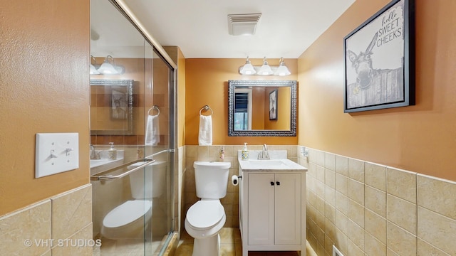 1375 Atkinson Rd, Green Oaks, IL 60048 - full bathroom featuring tile walls, toilet, a wainscoted wall, a stall shower, and vanity