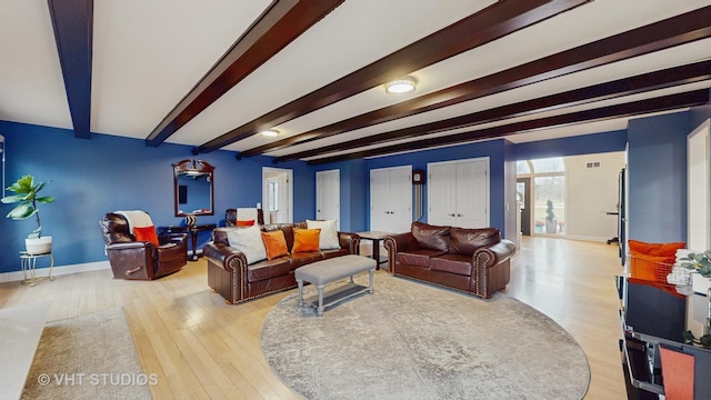1375 Atkinson Rd, Green Oaks, IL 60048 - living room featuring beam ceiling, light wood-style floors, and baseboards
