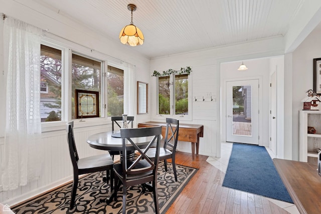 dining room featuring hardwood / wood-style flooring and wooden ceiling