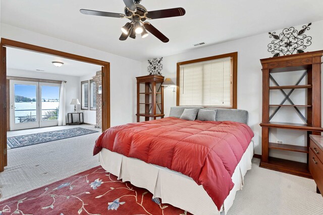bedroom featuring carpet floors, access to exterior, ceiling fan, and baseboards