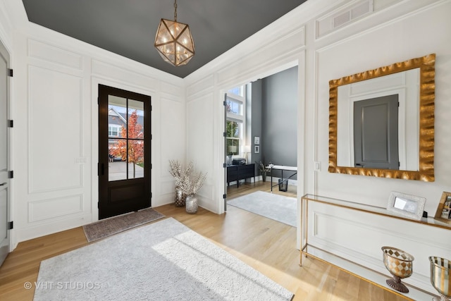 1110 Hickory Dr, Western Springs, IL 60558 - foyer featuring light wood-style flooring and a chandelier