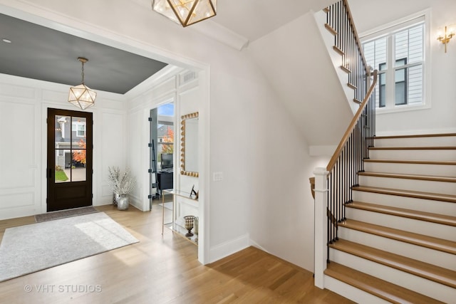1110 Hickory Dr, Western Springs, IL 60558 - entrance foyer with wood finished floors, stairs, and baseboards