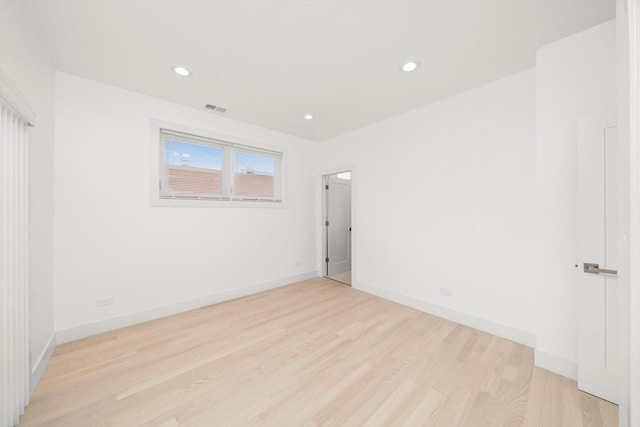 2700 W Jackson Blvd, Chicago, IL 60612 - empty room featuring light wood-type flooring, recessed lighting, and baseboards