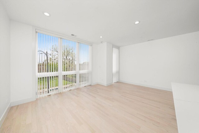 2700 W Jackson Blvd, Chicago, IL 60612 - unfurnished room with light wood-type flooring, baseboards, and recessed lighting