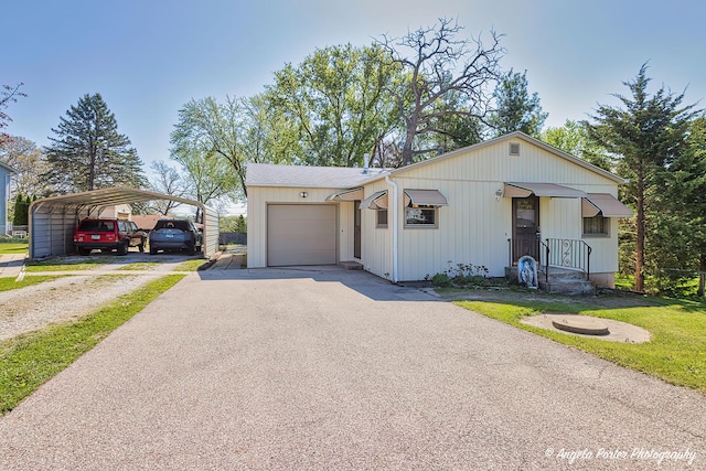 5308 Wonder Woods Dr, Wonder Lake, IL 60097 - view of front of property featuring driveway, a detached carport, and an attached garage