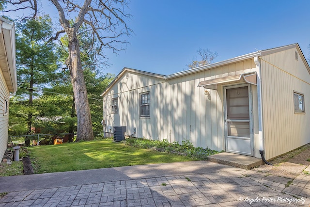 5308 Wonder Woods Dr, Wonder Lake, IL 60097 - view of side of home featuring central AC unit and a patio