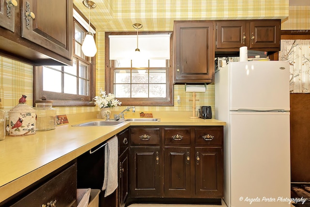 5308 Wonder Woods Dr, Wonder Lake, IL 60097 - kitchen featuring freestanding refrigerator, a sink, healthy amount of natural light, light countertops, and wallpapered walls