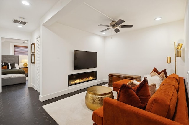 2250 W Argyle St Unit 1, Chicago, IL 60625 - living room with a glass covered fireplace, recessed lighting, ceiling fan, and baseboards