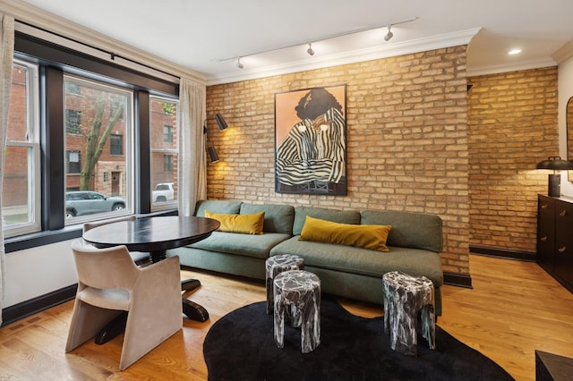 2250 W Argyle St Unit 1, Chicago, IL 60625 - living area featuring track lighting, brick wall, wood finished floors, and crown molding