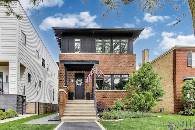 2312 W Hutchinson St, Chicago, IL 60618 - view of front of property featuring brick siding and a front lawn