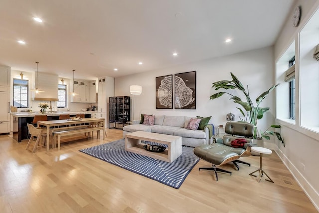 2312 W Hutchinson St, Chicago, IL 60618 - living room featuring light wood-style flooring, recessed lighting, and baseboards