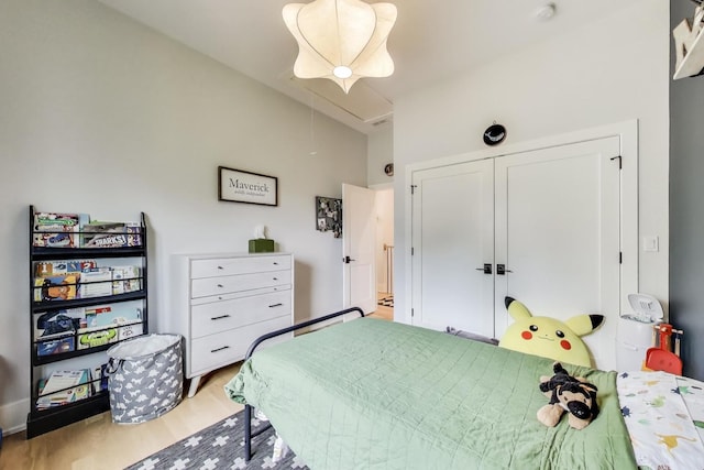 2312 W Hutchinson St, Chicago, IL 60618 - bedroom featuring attic access, wood finished floors, and a closet