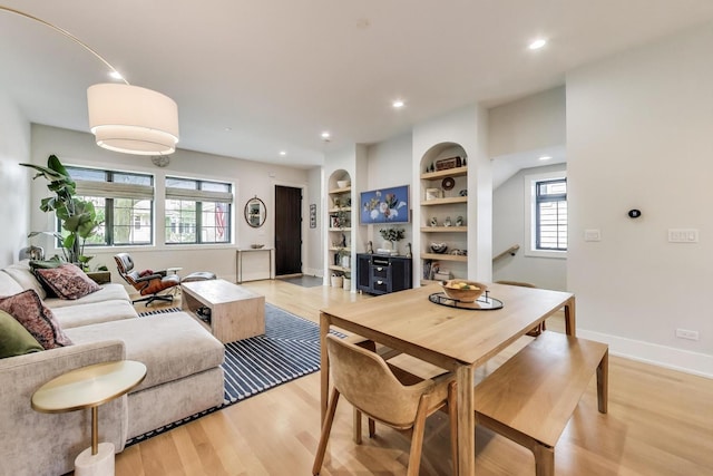 2312 W Hutchinson St, Chicago, IL 60618 - dining area featuring light wood-style flooring, built in shelves, recessed lighting, and baseboards