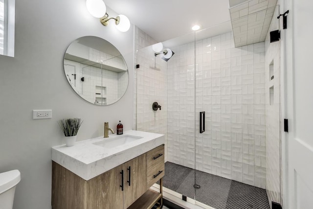 2312 W Hutchinson St, Chicago, IL 60618 - bathroom featuring a shower stall, vanity, toilet, and recessed lighting
