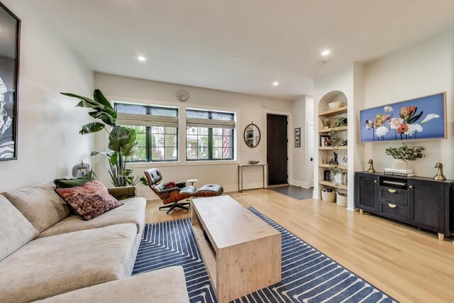 2312 W Hutchinson St, Chicago, IL 60618 - living room featuring light wood-style flooring, built in shelves, recessed lighting, and baseboards