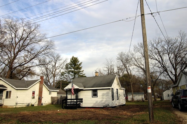 215 S Moore St, South Beloit, IL 61080 - view of front of property with roof with shingles and a chimney