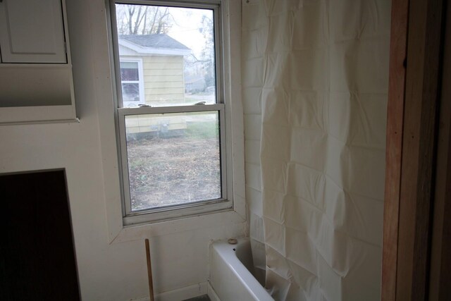 215 S Moore St, South Beloit, IL 61080 - bathroom with a tub and a shower with curtain