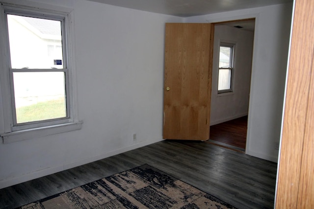 215 S Moore St, South Beloit, IL 61080 - empty room featuring baseboards and wood finished floors