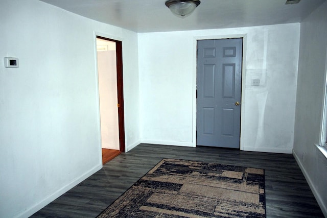 215 S Moore St, South Beloit, IL 61080 - hallway featuring baseboards and dark wood-type flooring