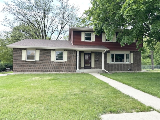 77 Briarcliff Ln, Bourbonnais, IL 60914 - traditional-style house with brick siding and a shingled roof
