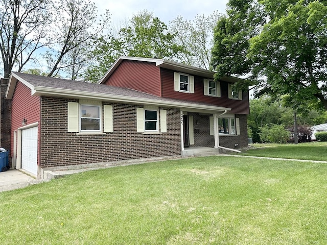 77 Briarcliff Ln, Bourbonnais, IL 60914 - view of front of house featuring brick siding, a front yard, and an attached garage