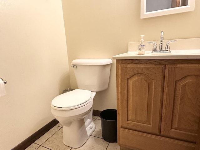 77 Briarcliff Ln, Bourbonnais, IL 60914 - half bathroom featuring baseboards, vanity, tile patterned flooring, and toilet